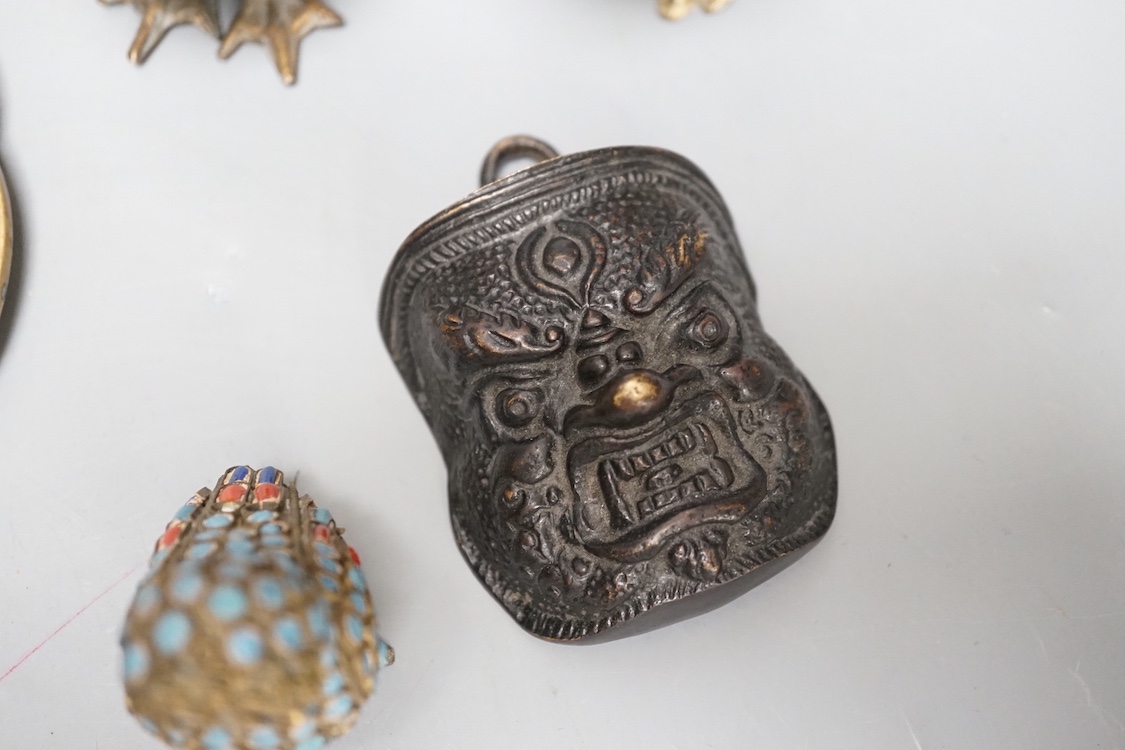 A Chinese water pipe, two Chinese bronze vases, a similar cup stand, a mask, three metal and enamel owl figures and a box